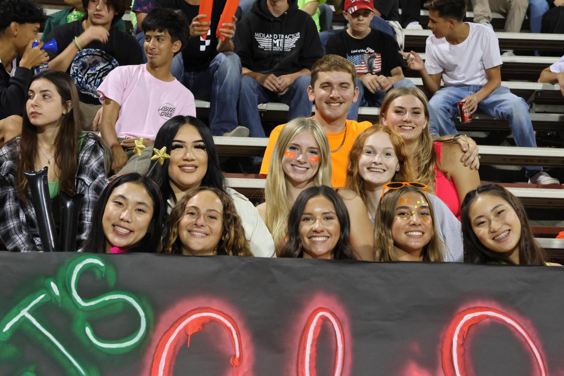 Students and community members enjoying the football game.