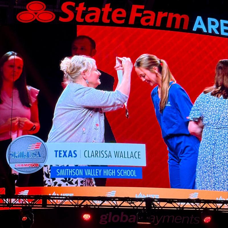 Clarissa Wallace receives the silver medal at national SkillsUSA