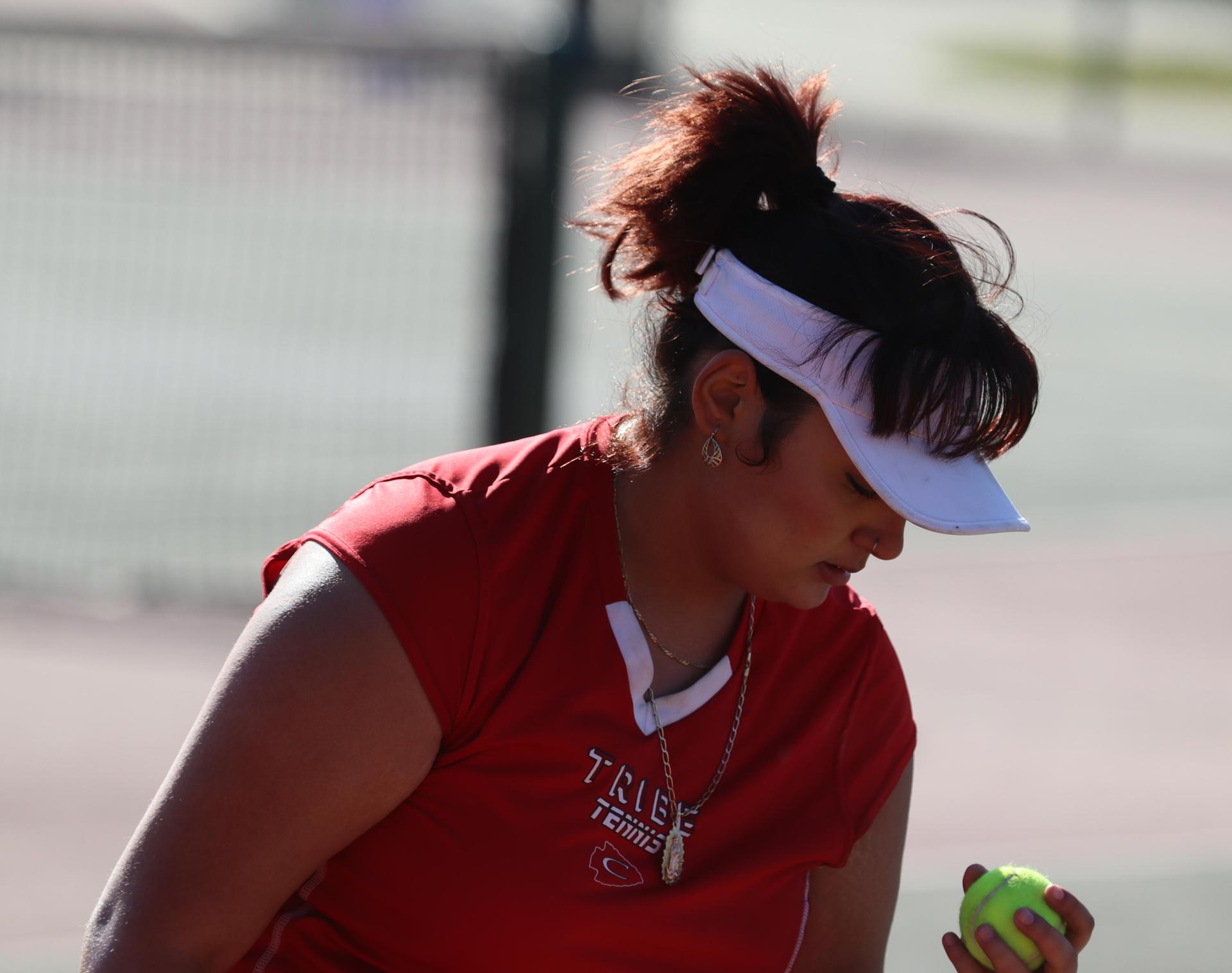 girls playing tennis against Golden Valley