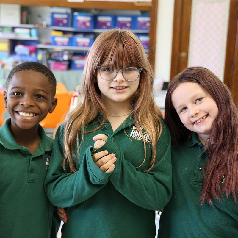 HSA students smiling in a classroom