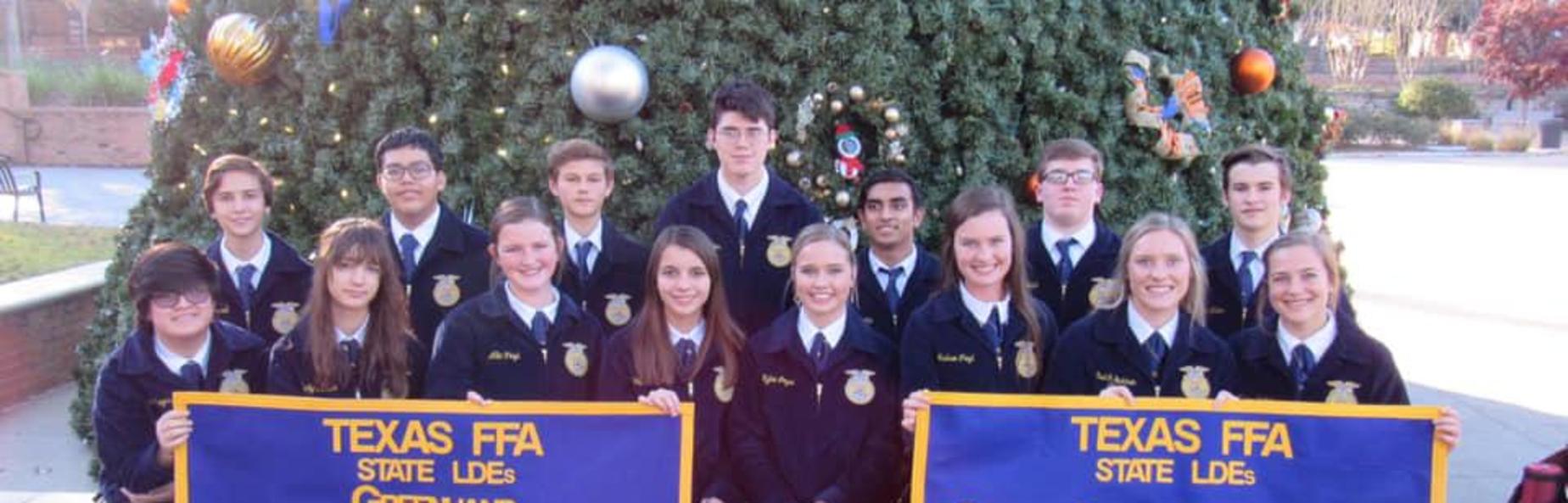 ffa students holding banners