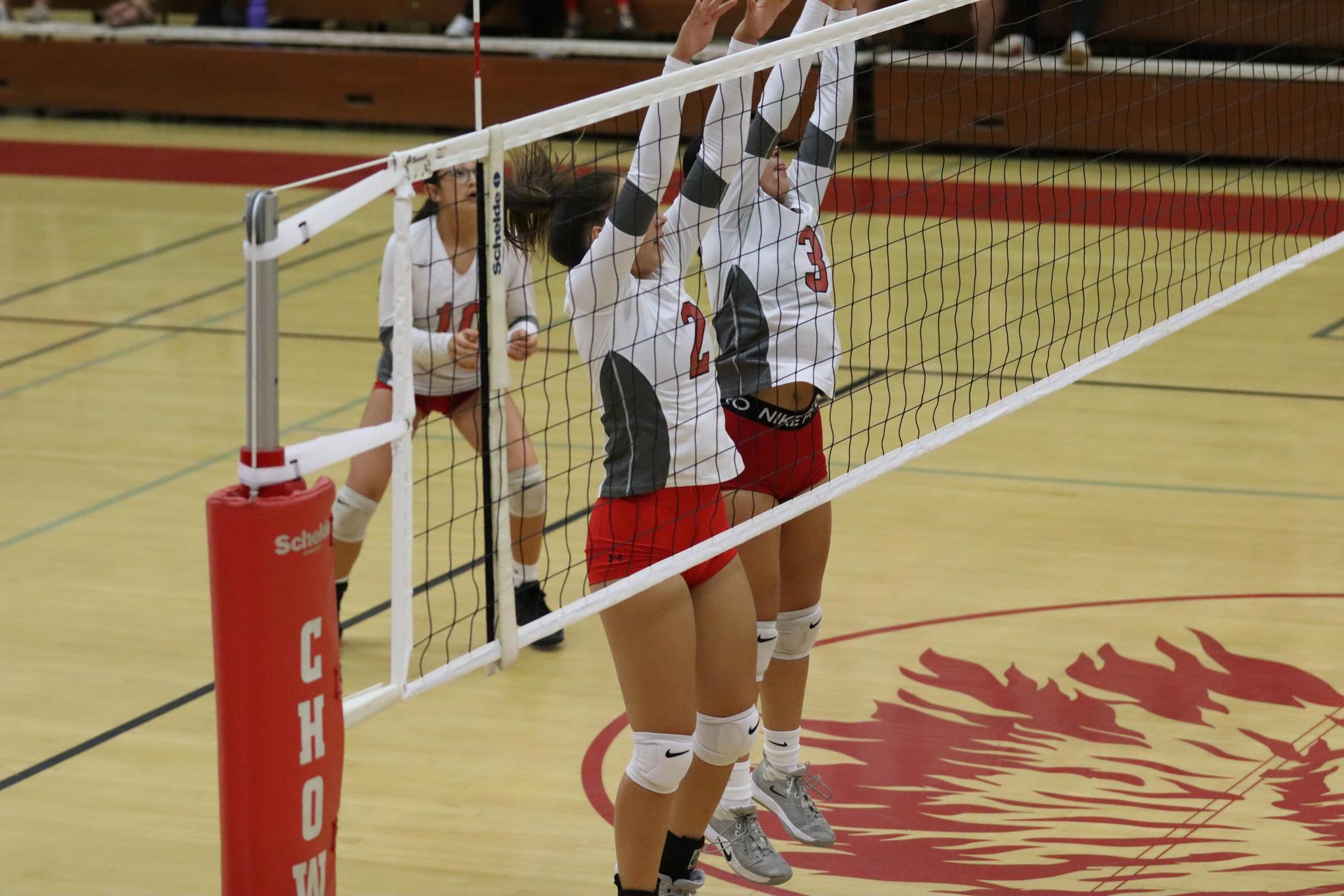 junior varsity girls playing volleyball against Liberty