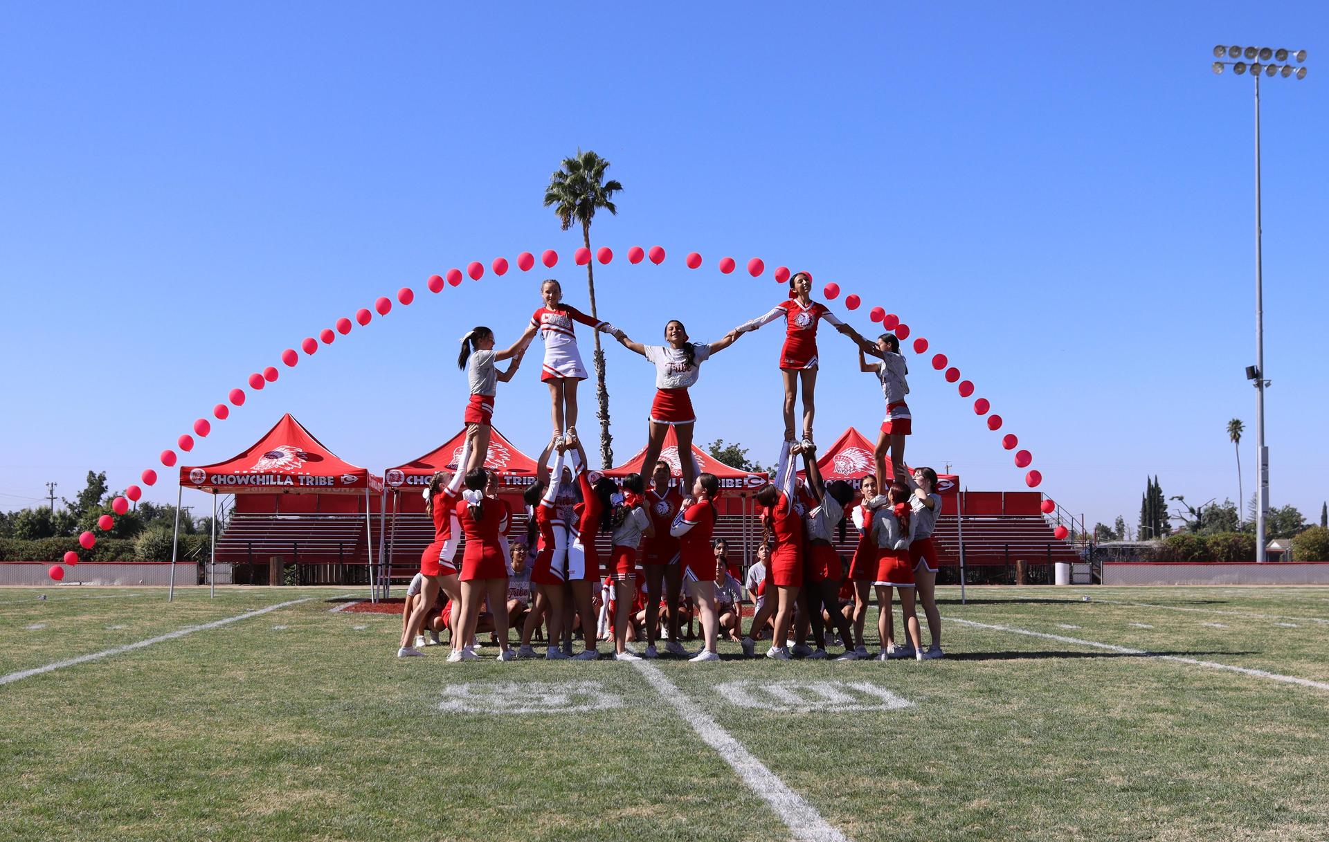 students and staff at the homecoming rally