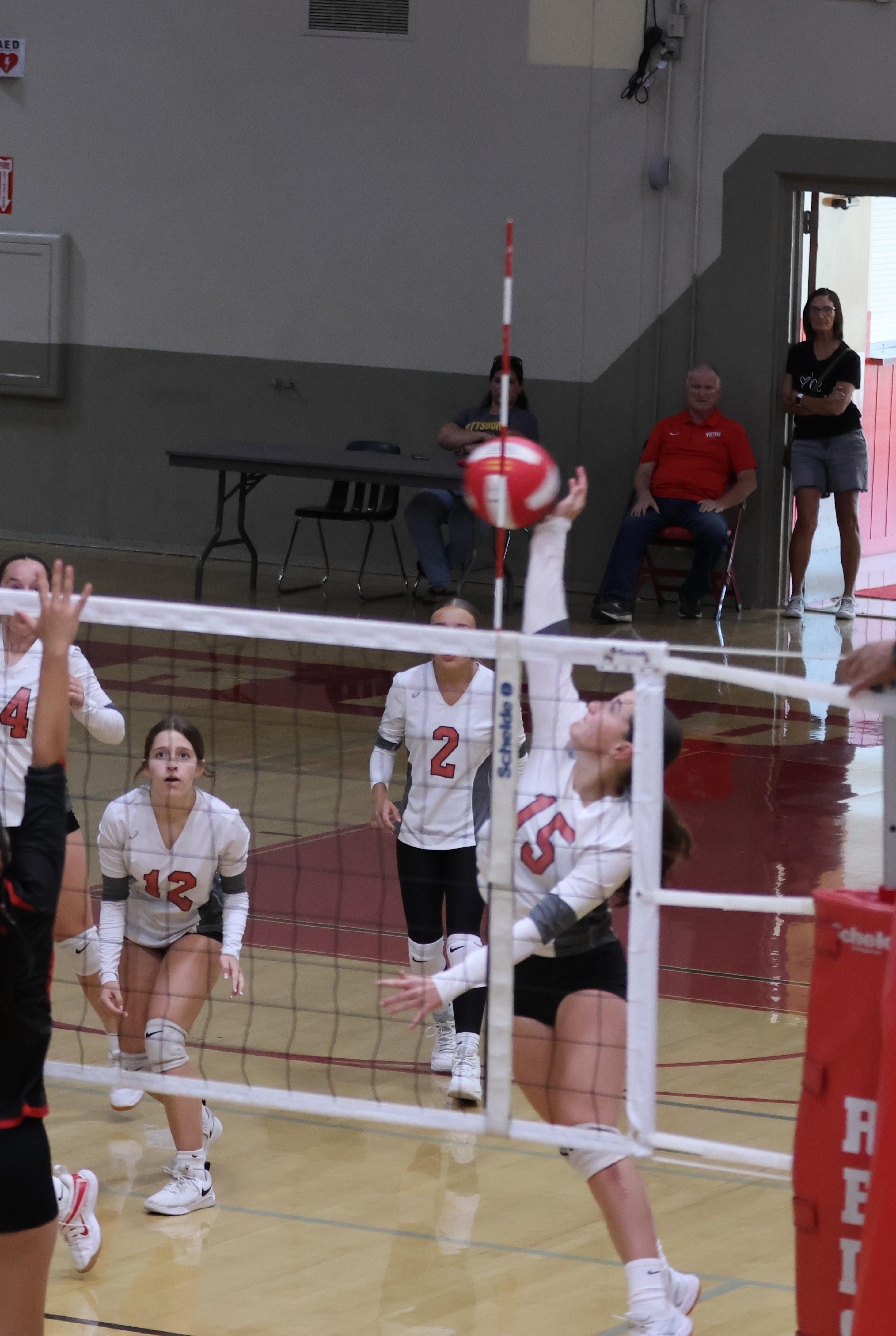 junior varsity girls playing volleyball 98