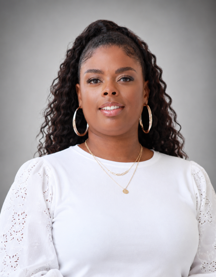 a black woman in a white shirt