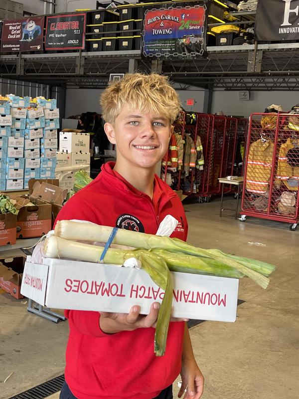 student smiling holding food