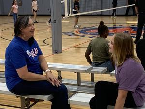 A mentor visits with her mentee at Wildcat Mentor kickoff 2025