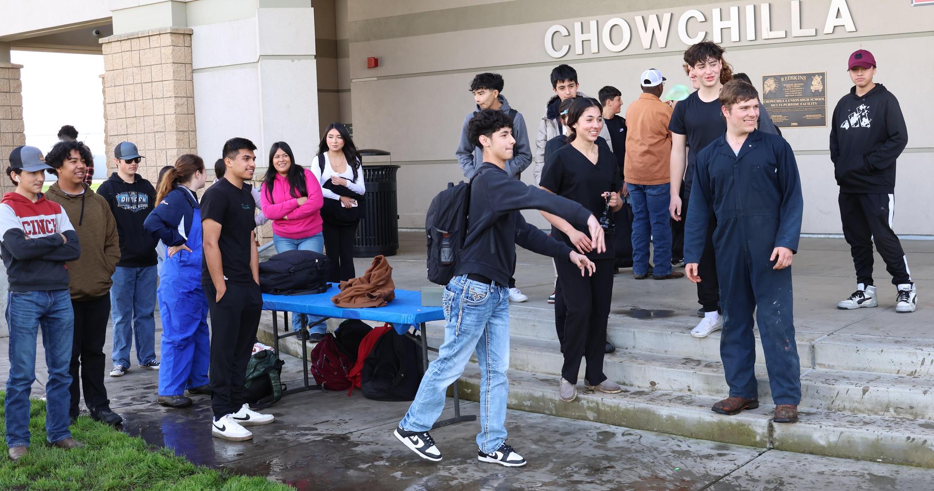 students and staff enjoying the water balloon toss