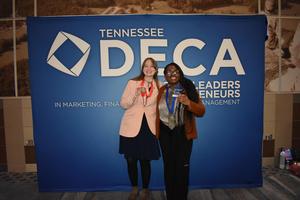 Smiling group of students, some with awards