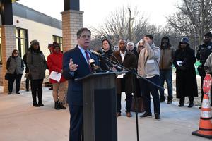 senator costa speaking at podium