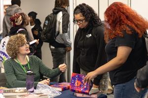 A student gets a book signed by Julie Berry