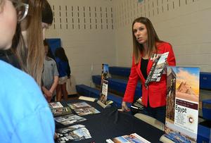 A travel agent discusses trips to Egypt with interested students.