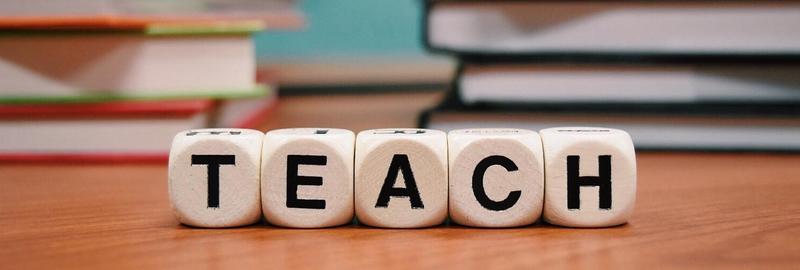 Blocks spelling the word teach