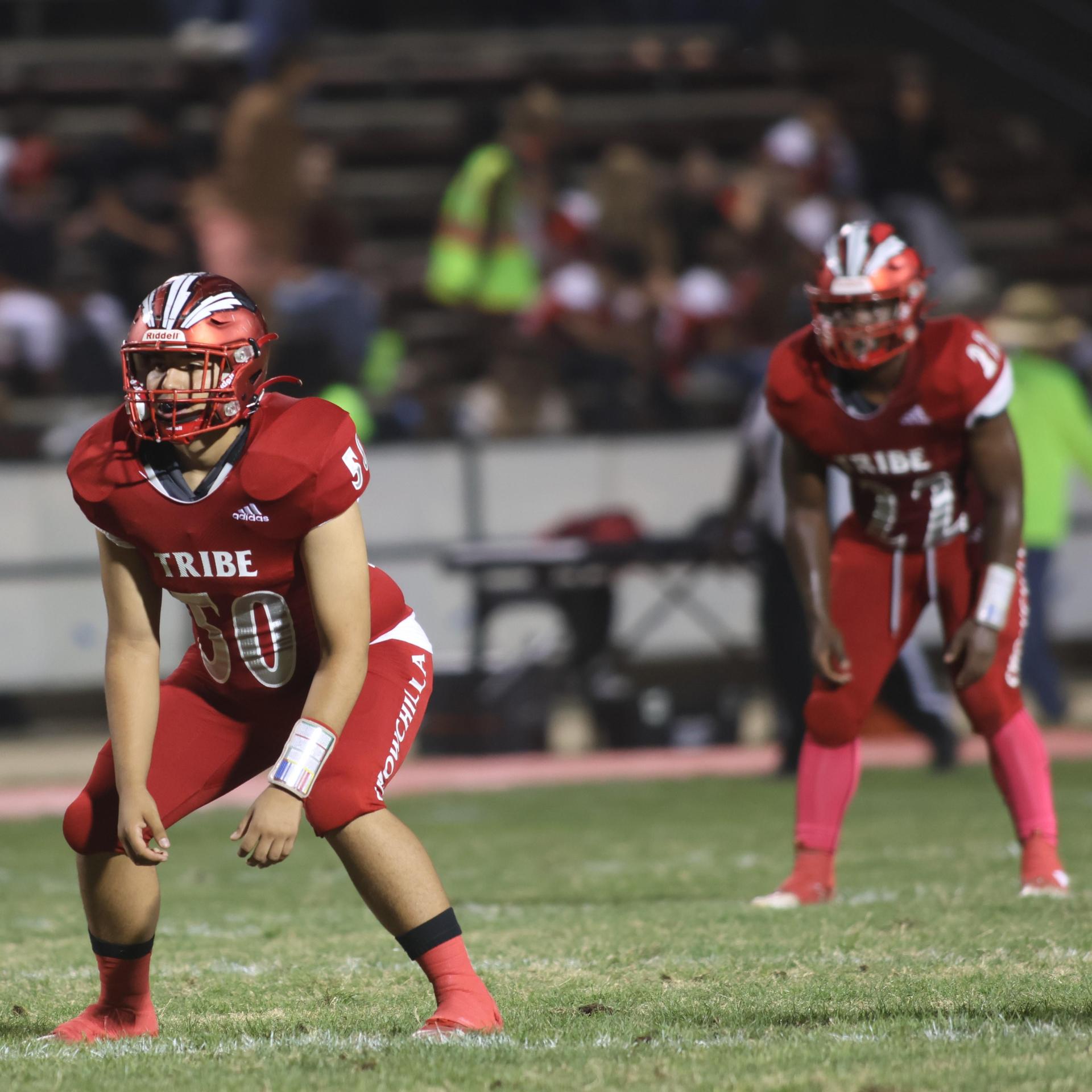 varsity boys playing football against Fowler
