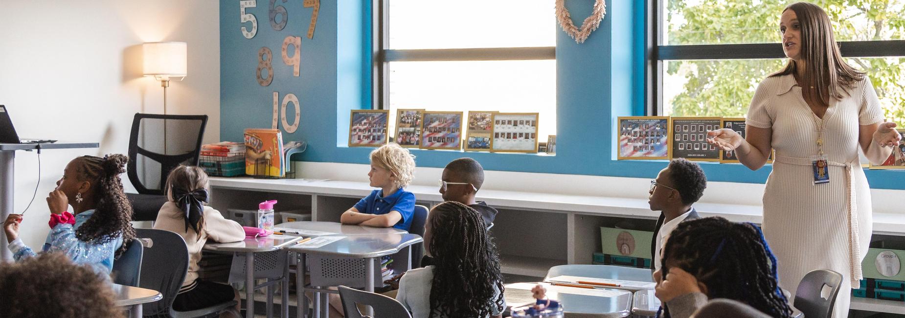 Students listen to a teacher