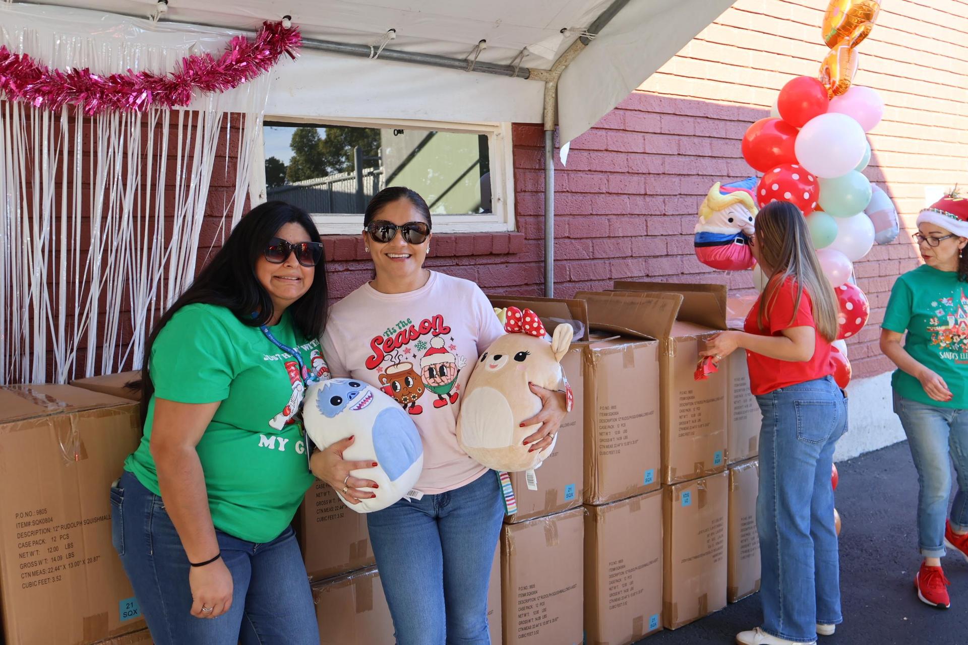 FRC Toy distribution-staff passing out squishmallows