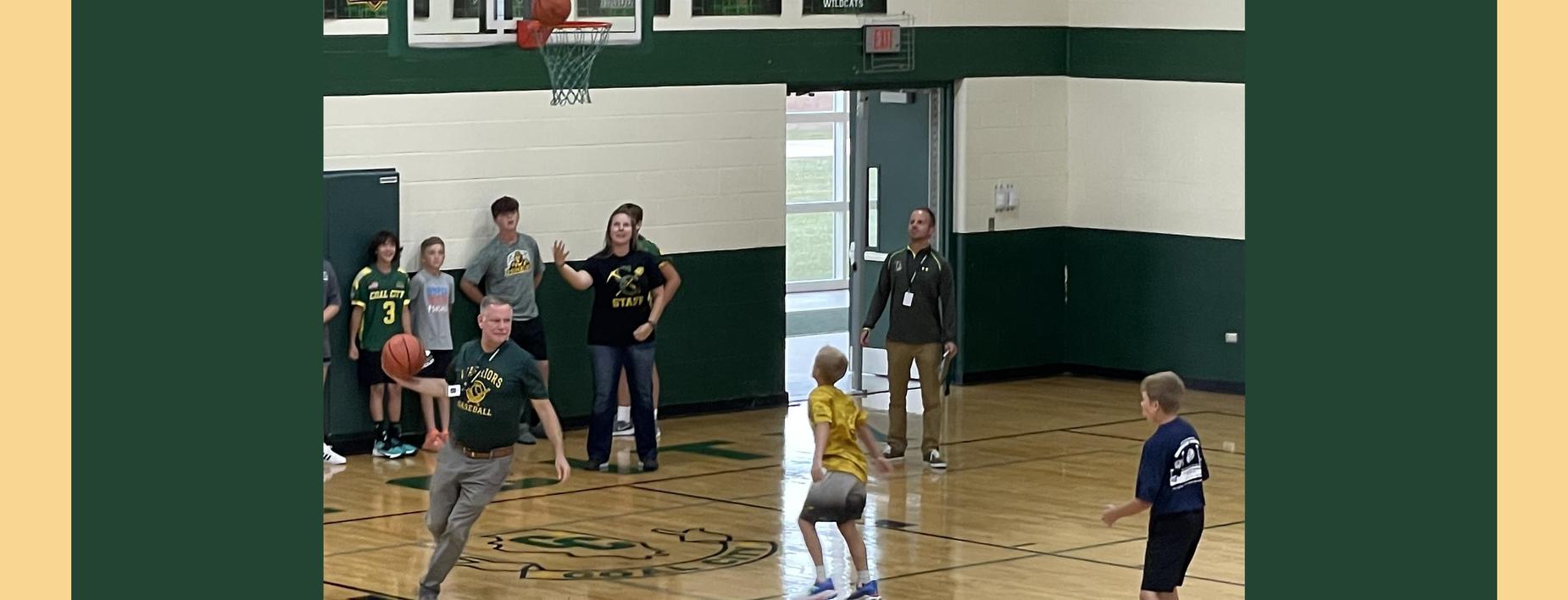 Mr Johnson shooting baskets