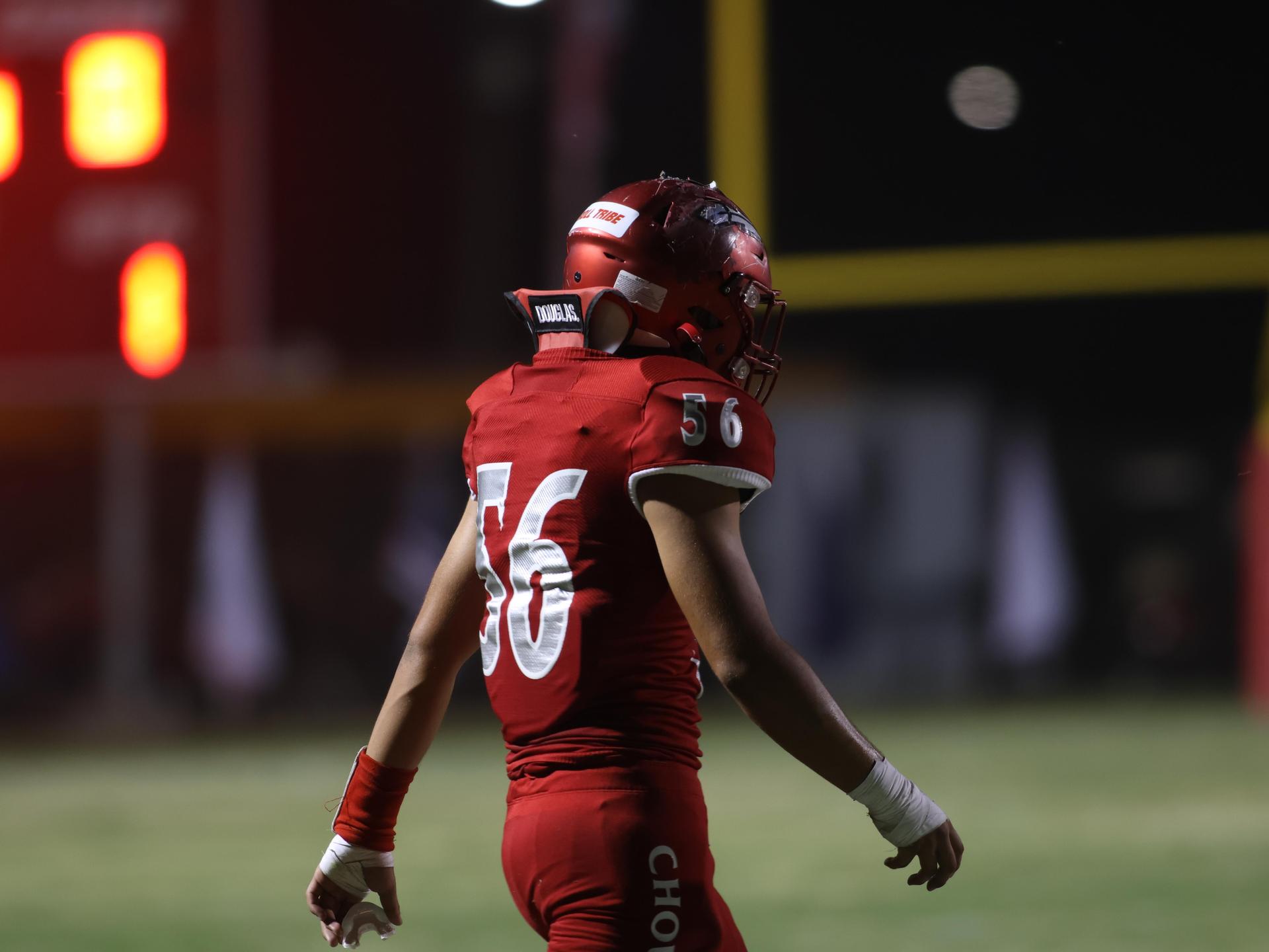 varsity boys playing football against Fowler