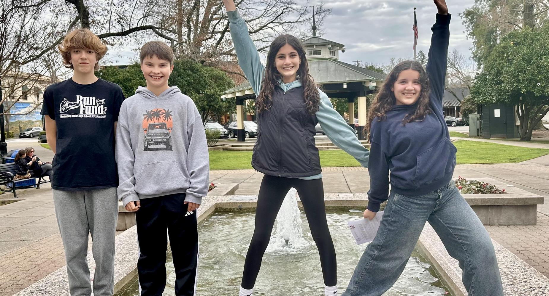 Four students posing in the Healdsburg Plaza