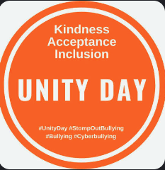 White and Orange circle with Unity Day in bold