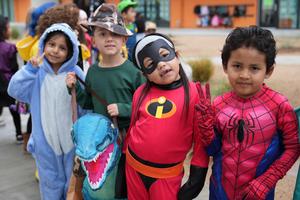 group of 4 students in halloween costumes