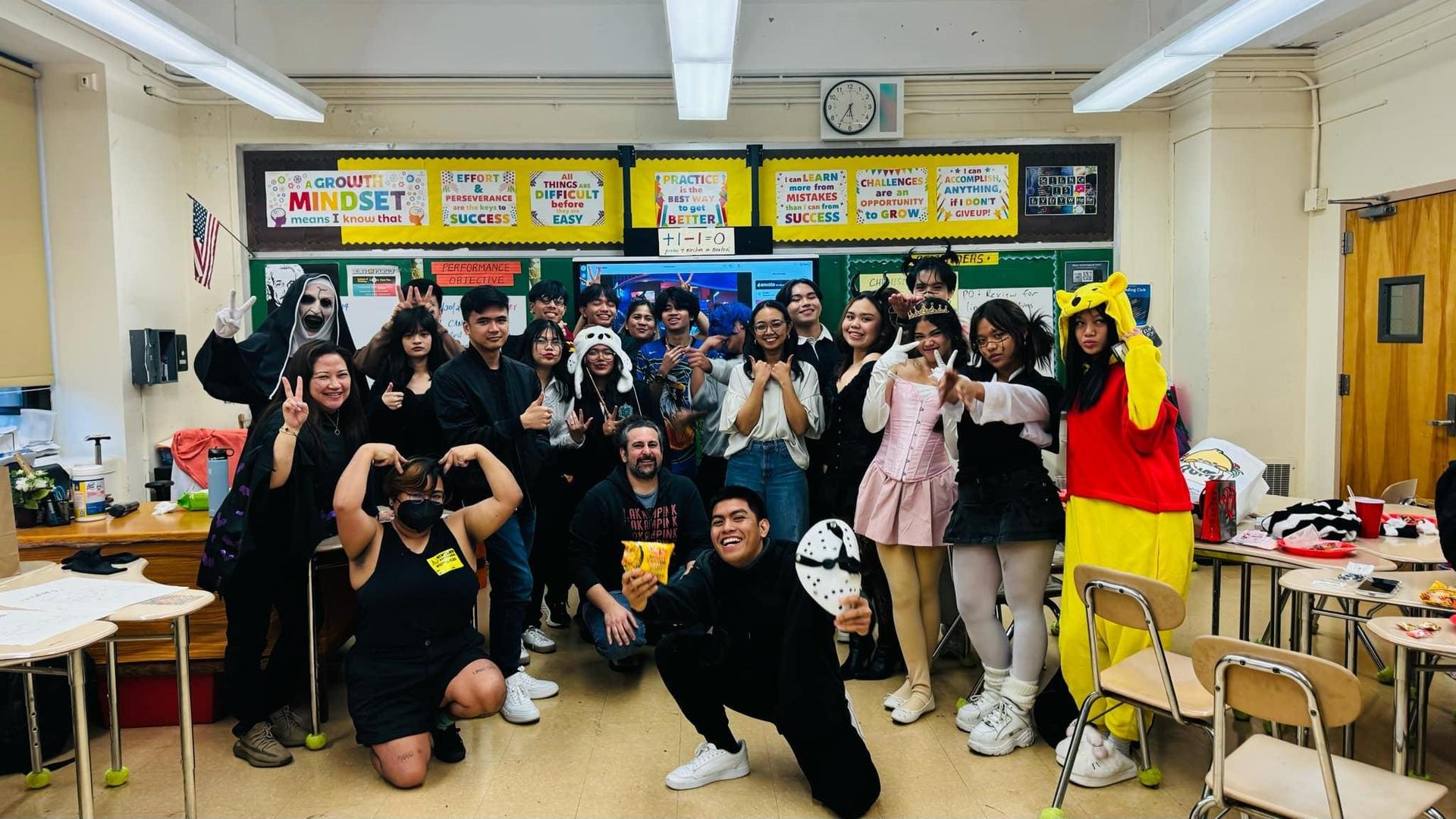 Students wearing costumes in a classroom