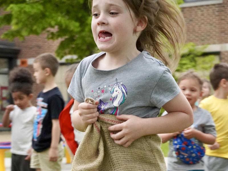 Student jumping in a sack race.