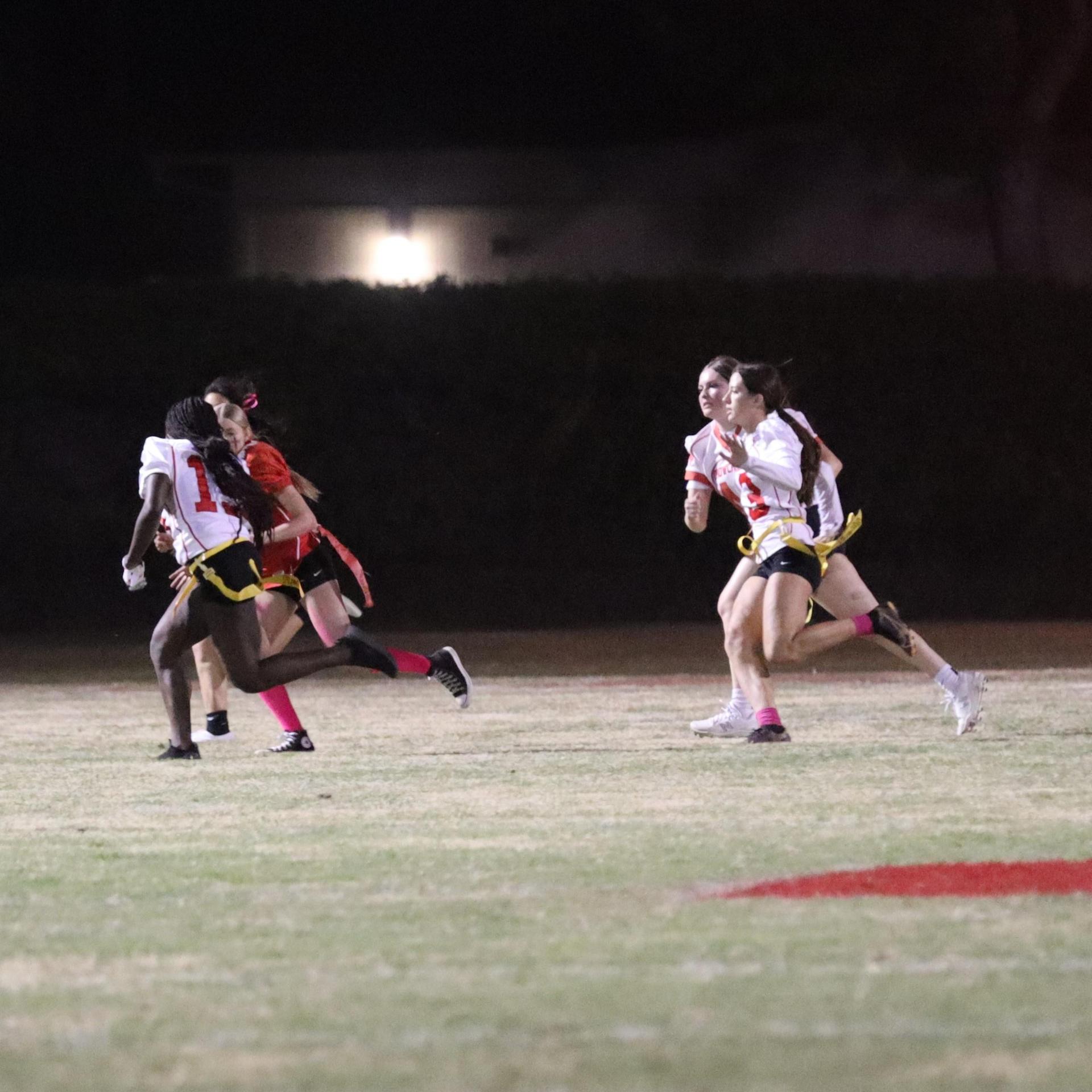 girls playing flag football
