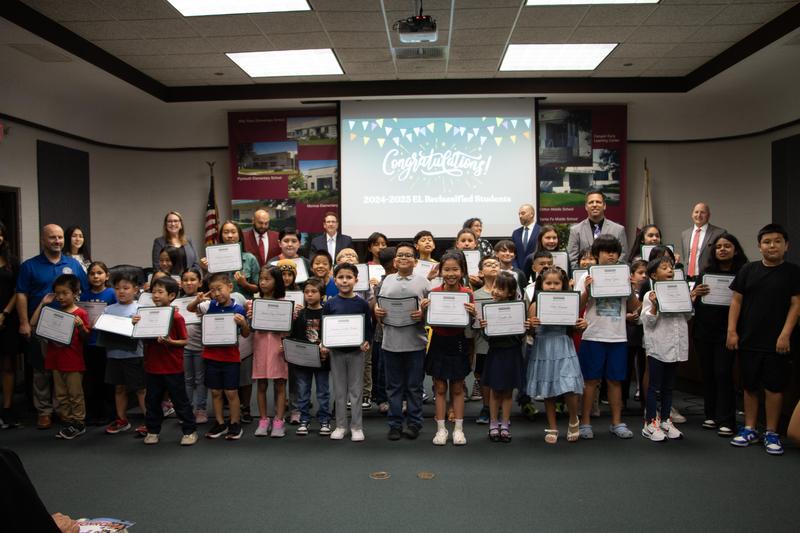 group of students with certificates