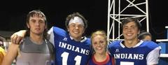 Football Players and Cheerleader Celebrate