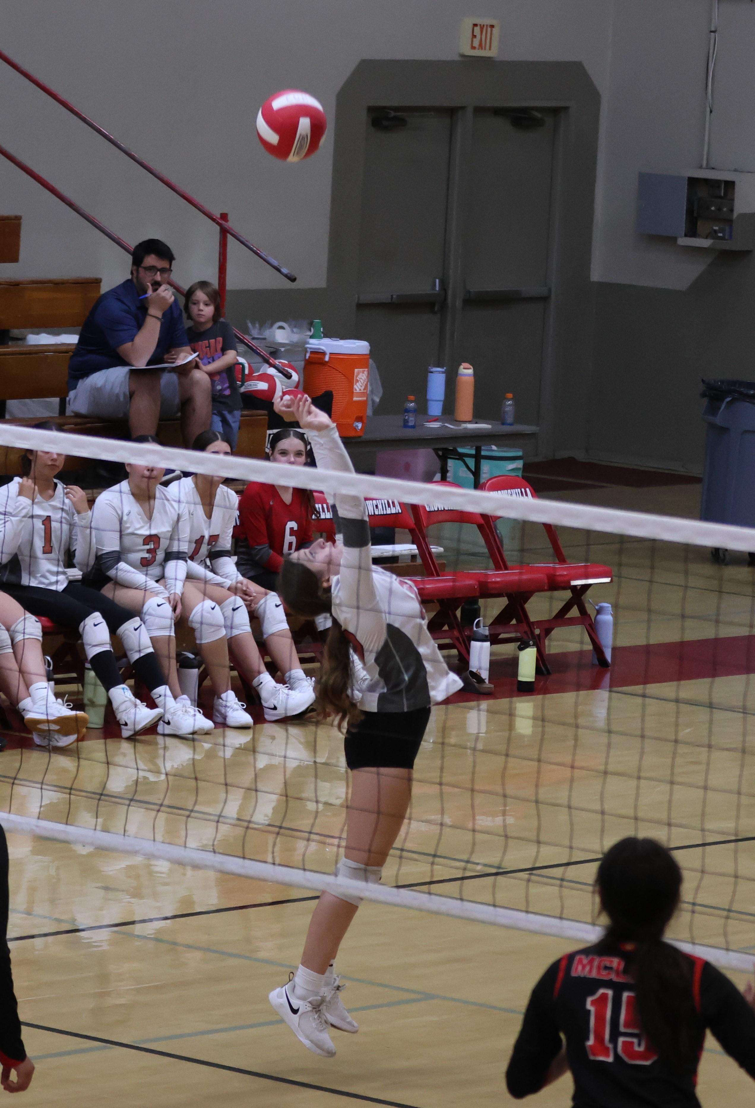 junior varsity girls playing volleyball 94