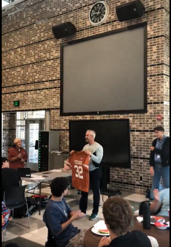 Mr. Boehme receiving a Texas jersey
