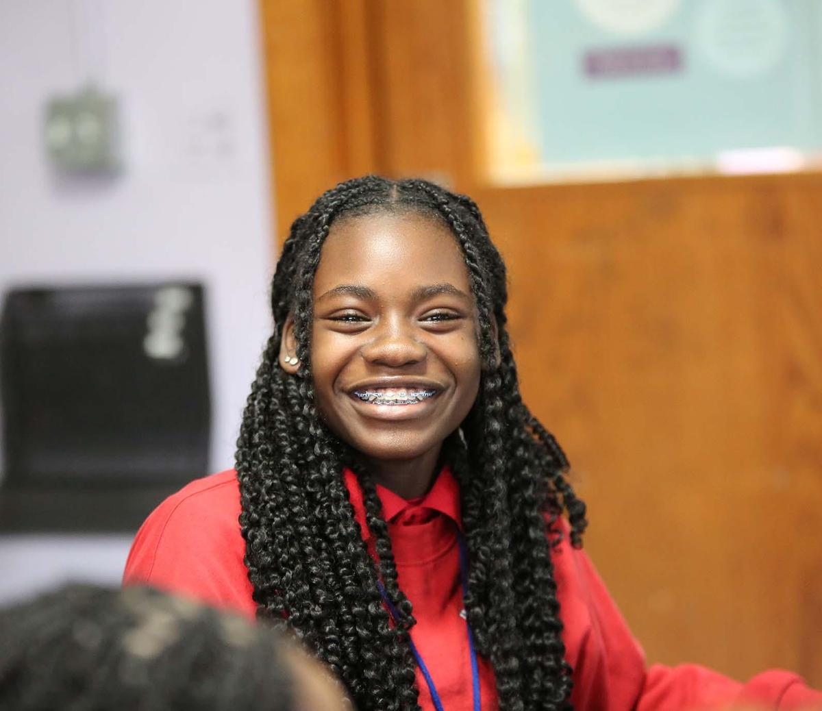 HSA Belmont student smiling in class