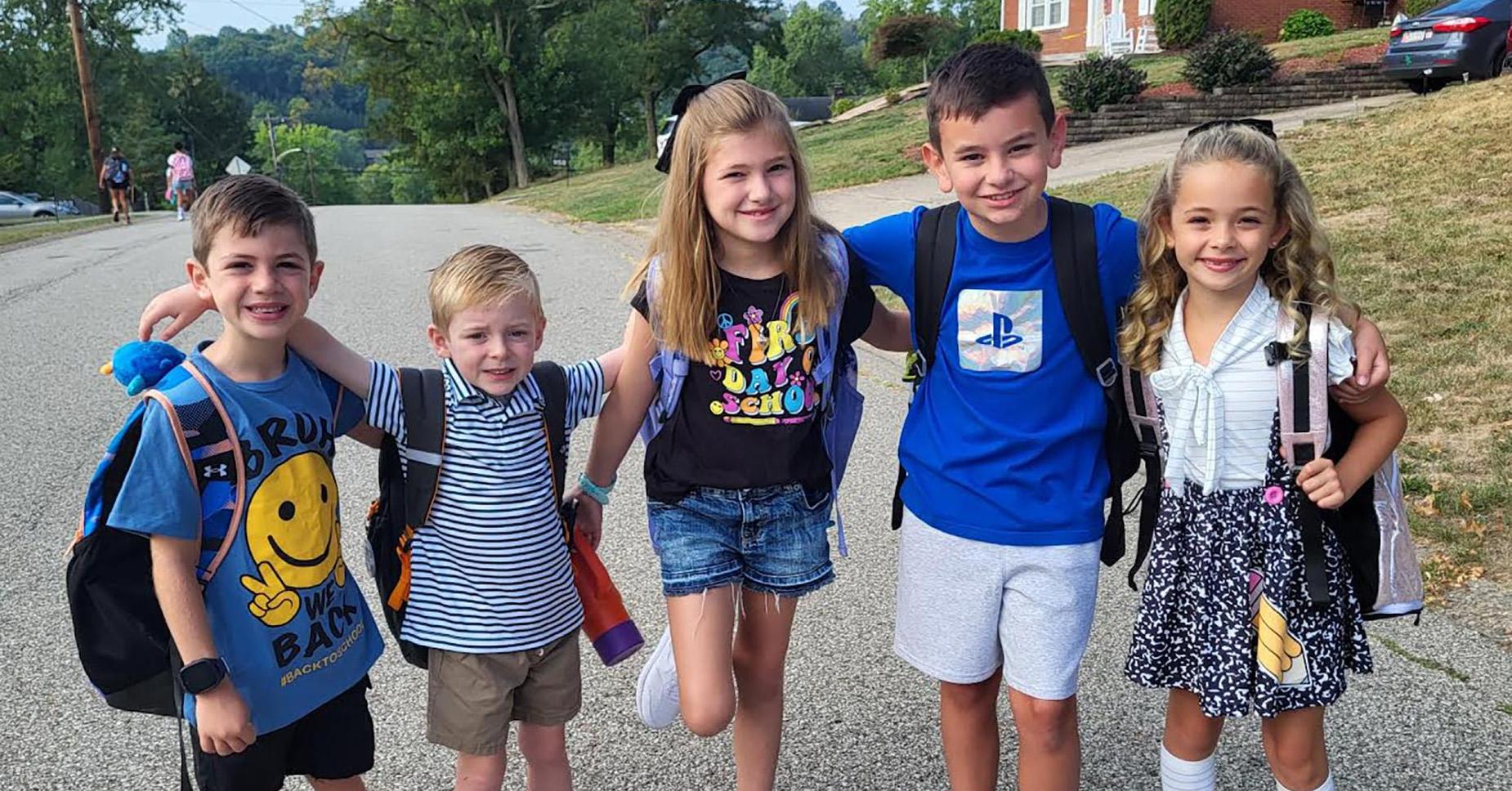 District Profile Kids at Bus Stop