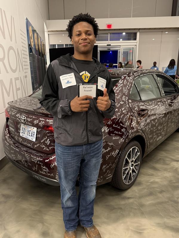 Rai'veon Feazell with his Beats Flex All Day Wireless Earphones