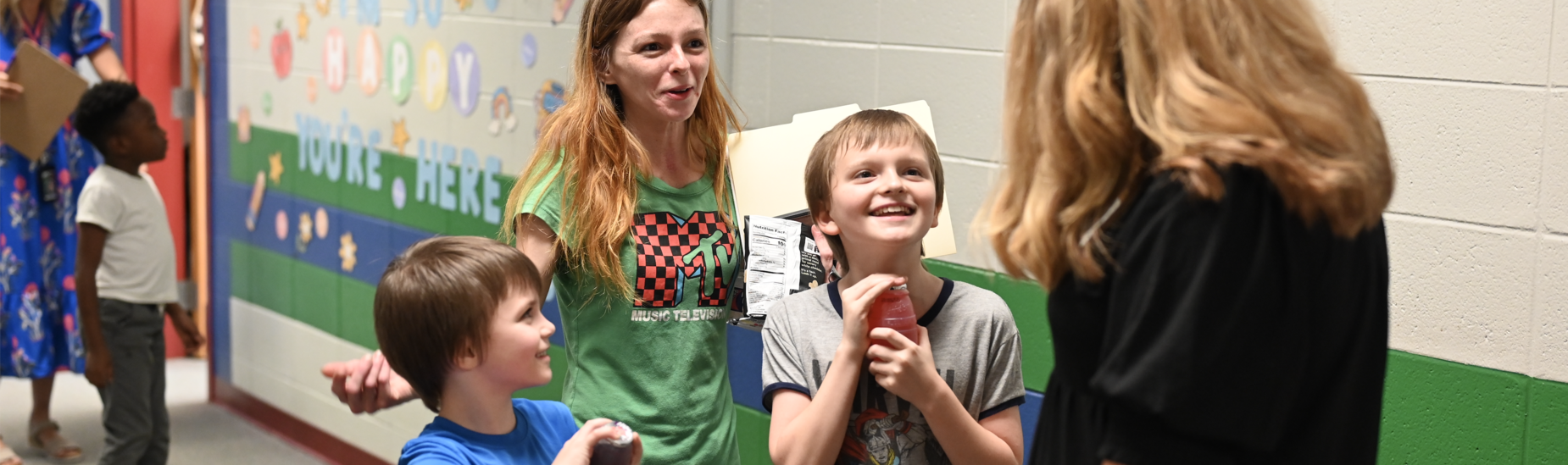 A mother and her two sons at open house