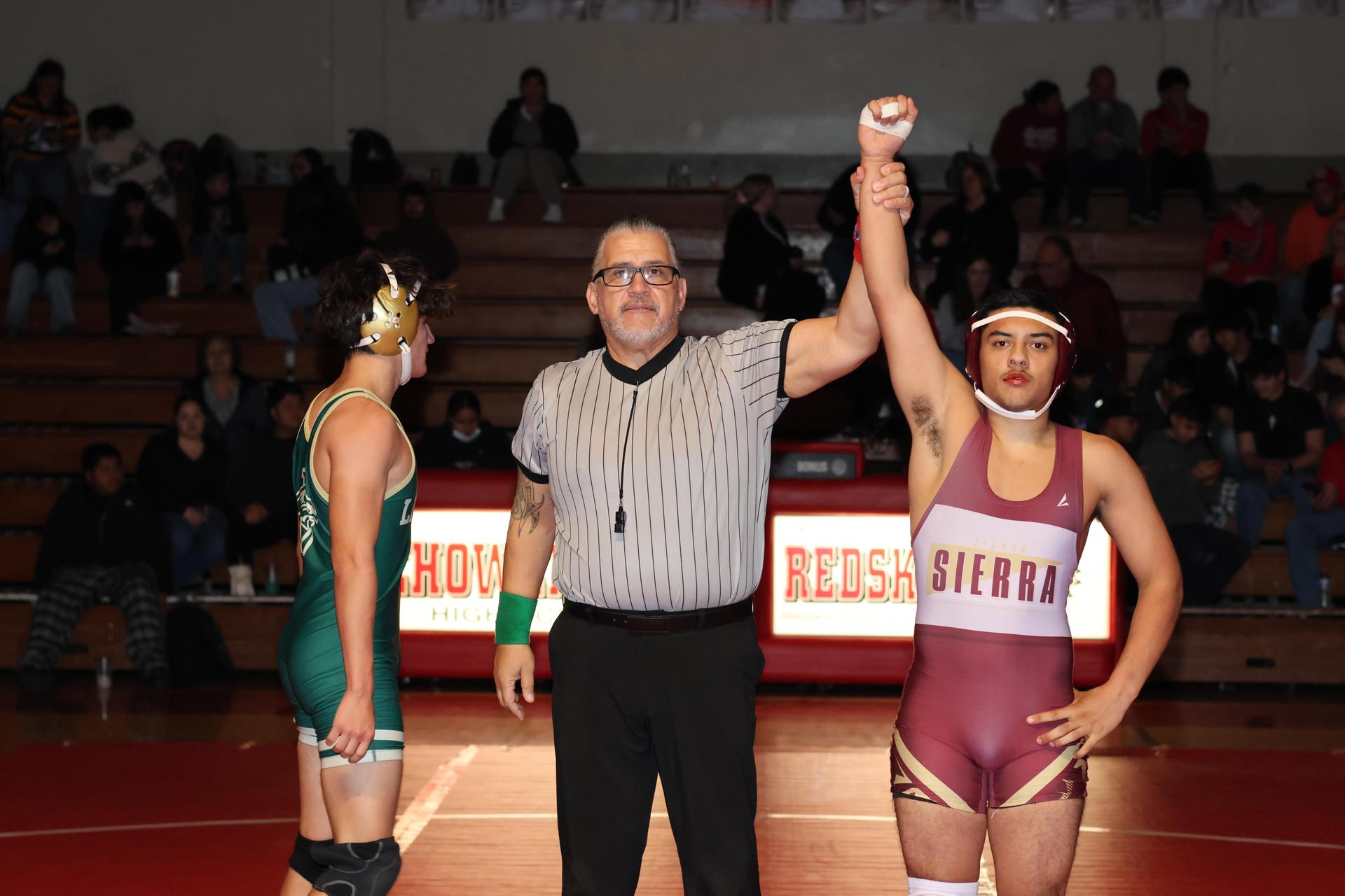 Wrestling winners with hands up 68
