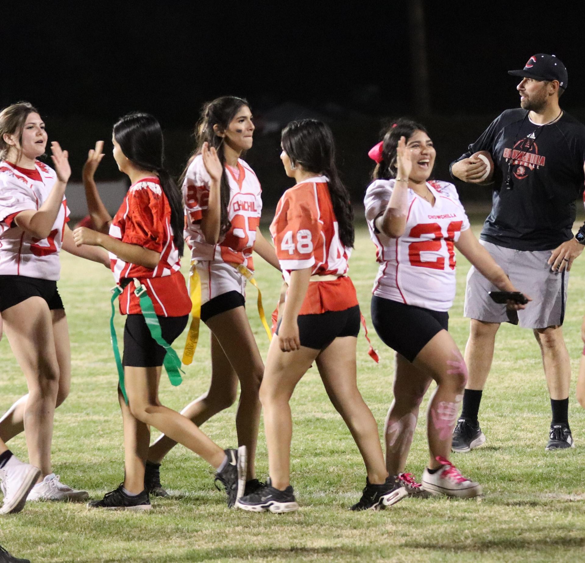 students shaking hands after the game