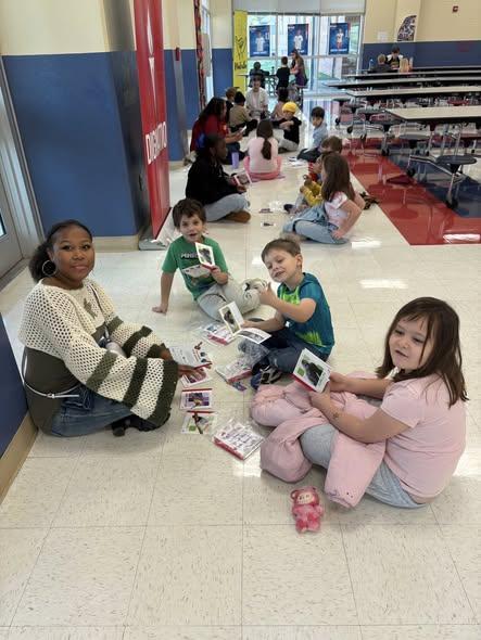 DES first grade students met Chick-Fil-A and PCHSs Child development class students and FCCLA members as they came to distribute books to the students as part of the Chick-fil-A and Britannica One Million Books giveaway.