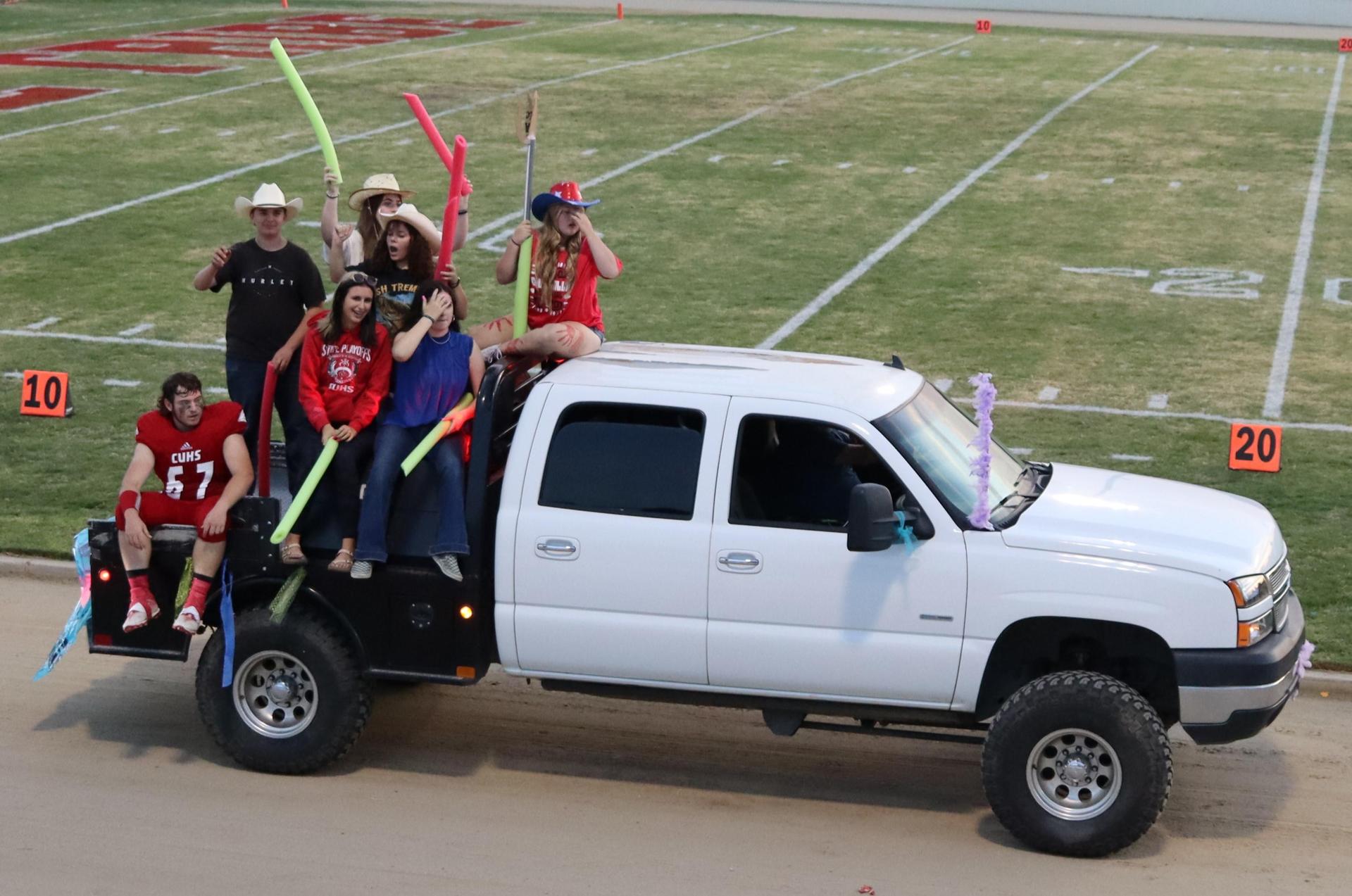 floats on the track between football games