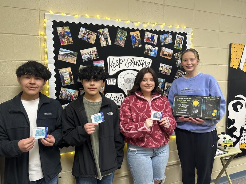 PHS winners holding up their prizes