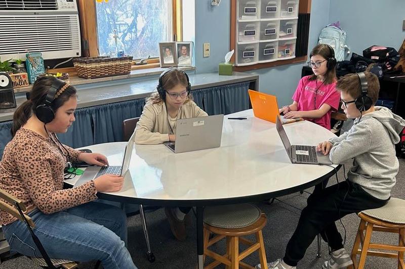 Madeline Patrick, Layla Cottrill, Phoebe Carneim, and Carter Iera wear the new headphones to focus on their independent lesson