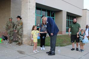 Dr. Ott greets a student on the first day of school