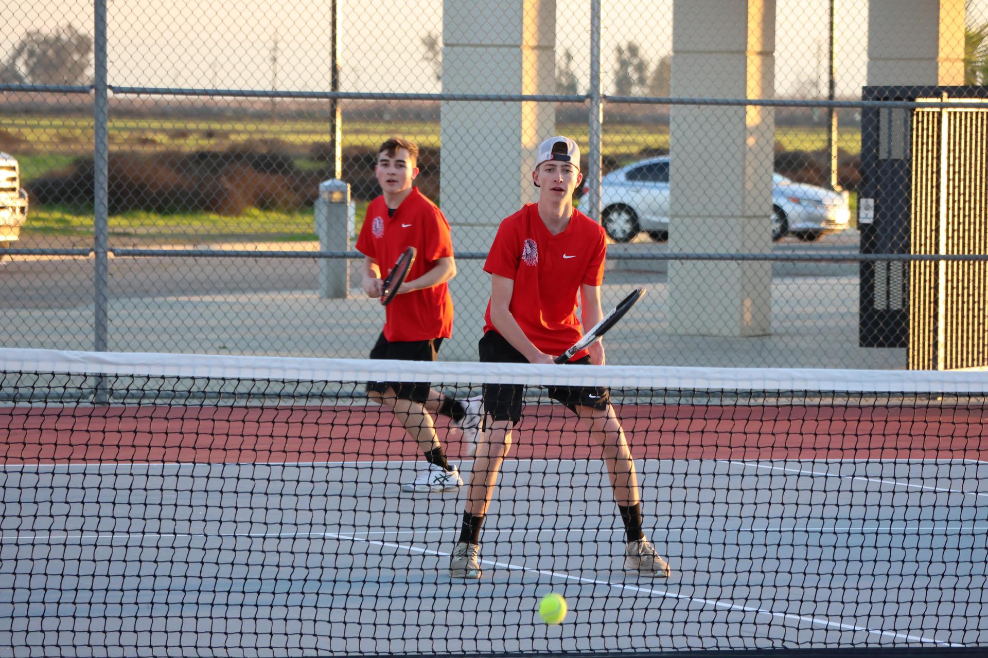 CUHS Boys playing tennis against coalinga