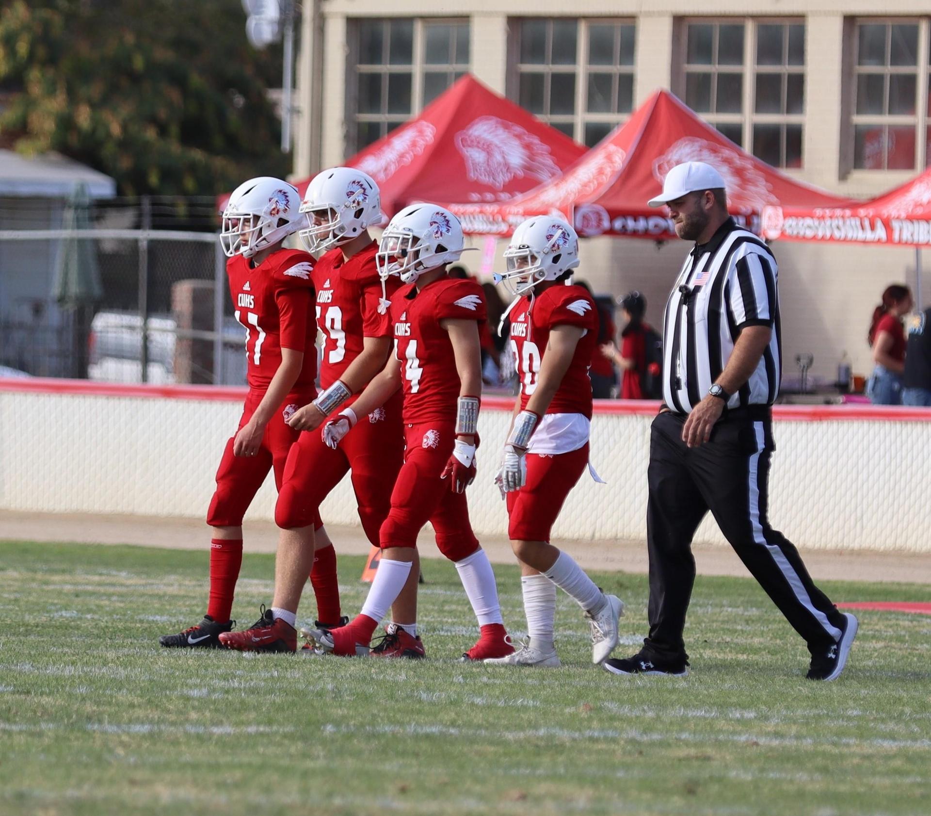  junior varsity football players in action against riverdale