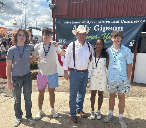 Bruin News Now crew films the weekly newscast at the Mississippi State Fair. They are standing here with Mississippi Agriculture Commissioner Andy Gipson.