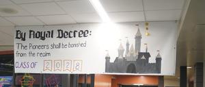 A class sign hung over their decorated hallway.