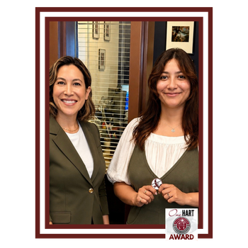 Two women with dark hair posing for a photo