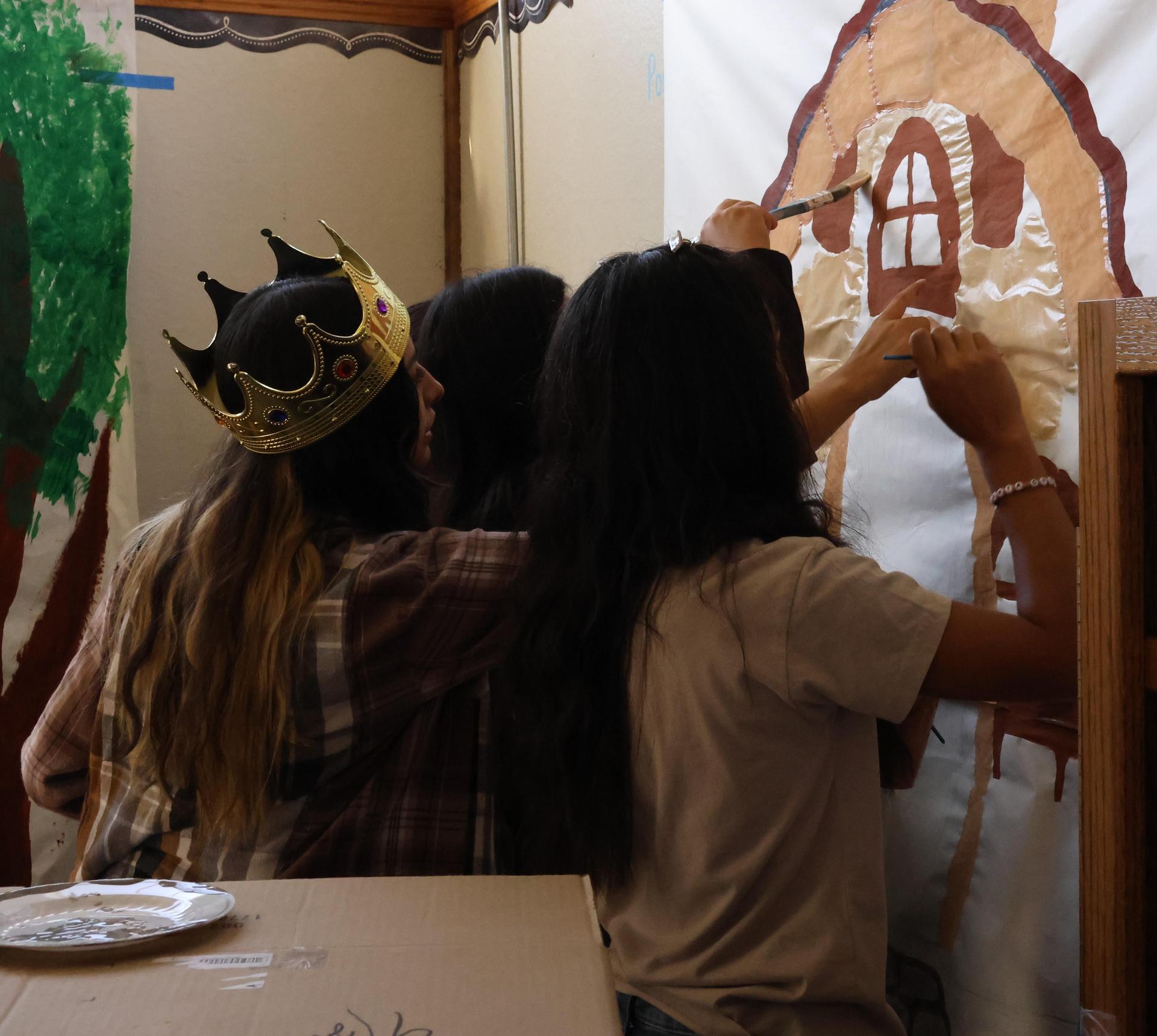 students, parents, and staff building floats for homecoming