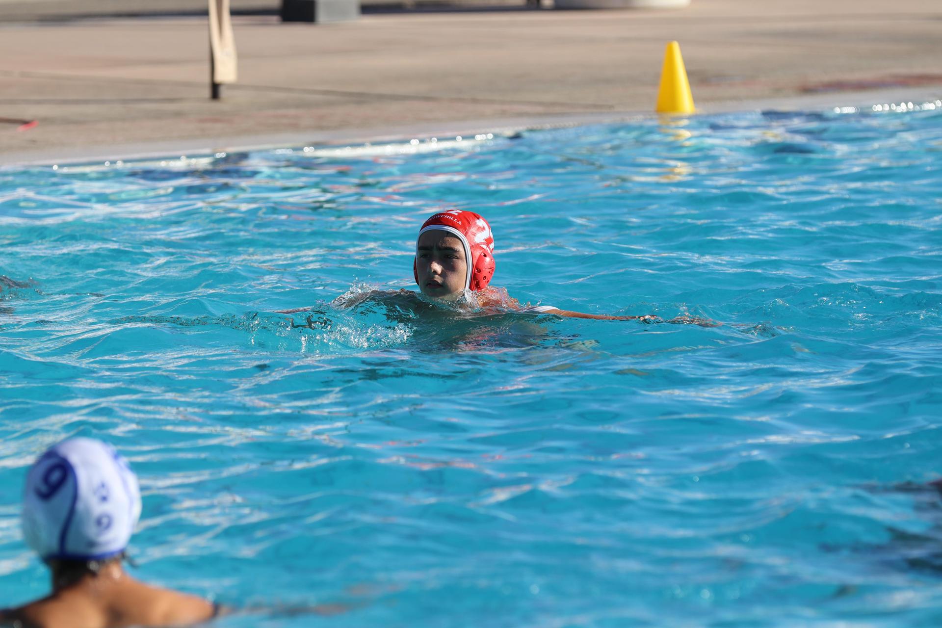 boys playing water polo against Madera